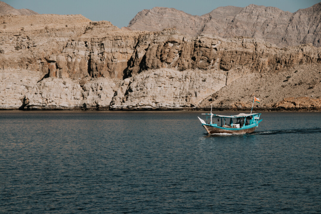 A boat cruising Musandam's Fjords