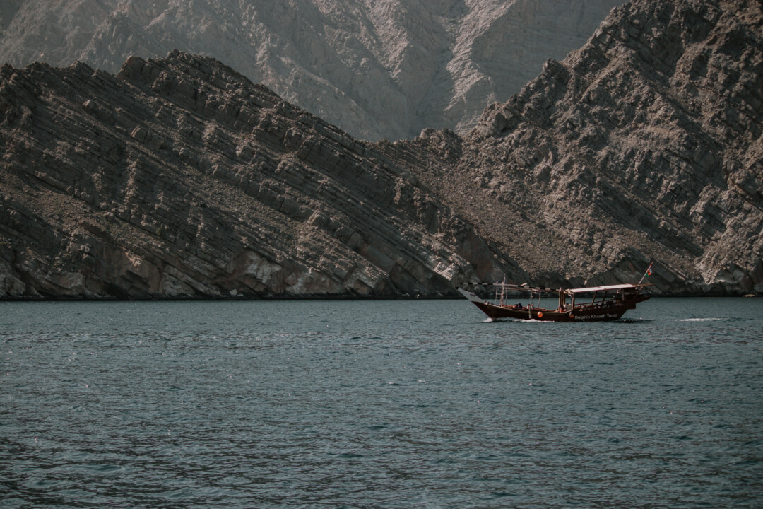 A boat with Musandam's mountains in the background