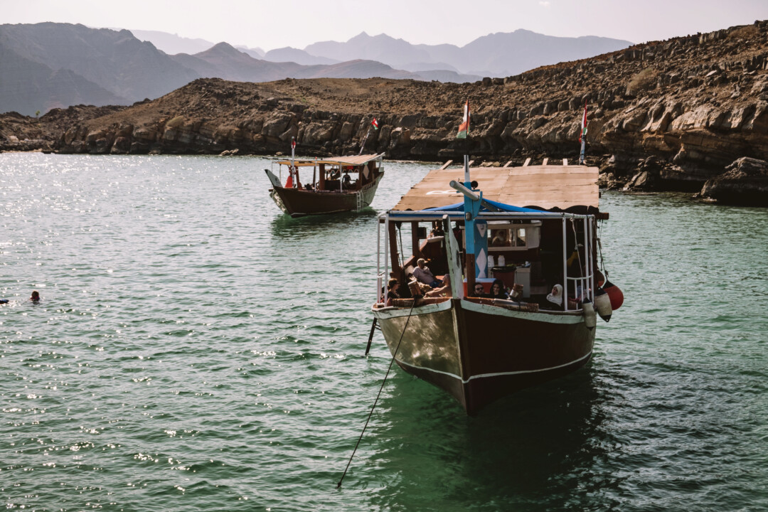 A drone shot of two boats anchored in the snorkeling area