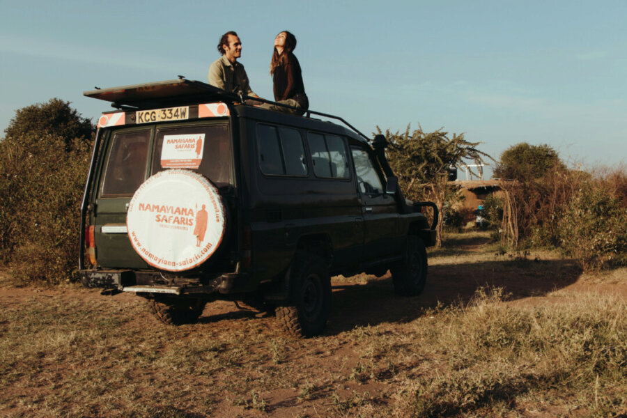 Pili and Dano on the safari vehicle
