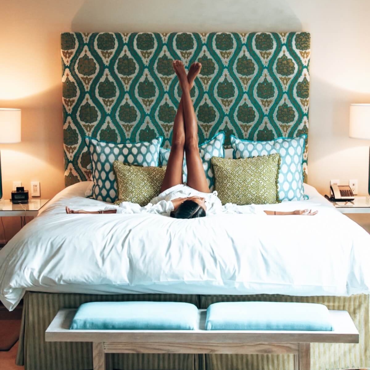 Women with legs up in a hotel bed in Barbados